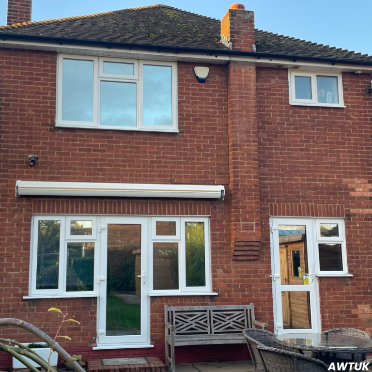 Image of a medium sized detached house with window film installed on the back windows