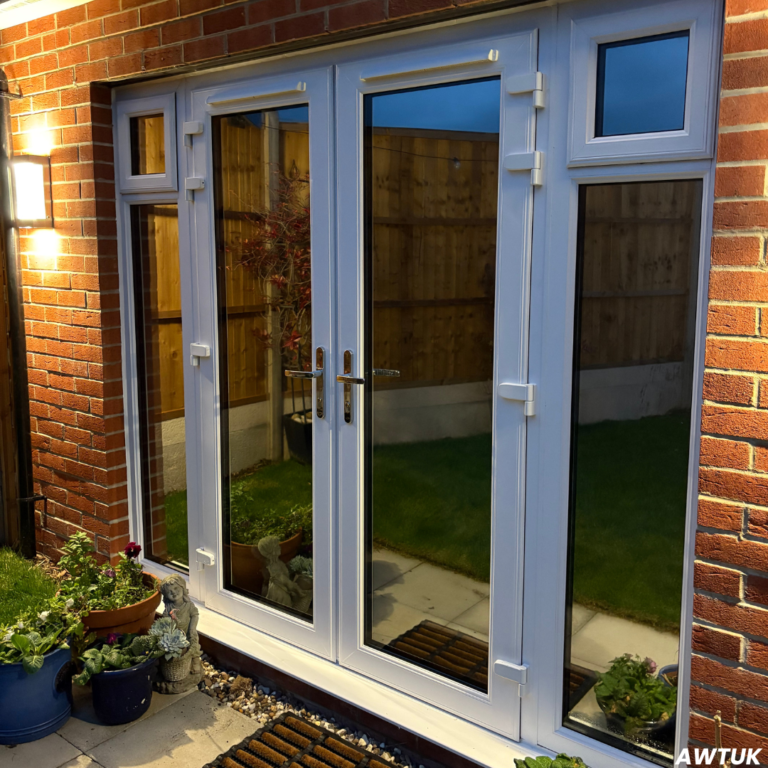 Patio doors in an Essex home with Privacy Window Film installed at night