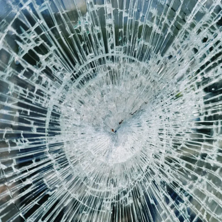 Close up of a smashed pane of glass