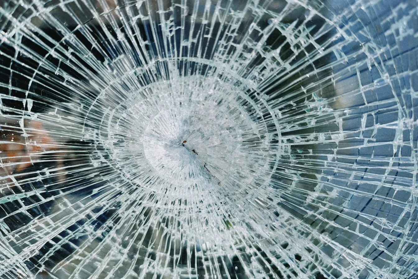 Image of a smashed pane of glass