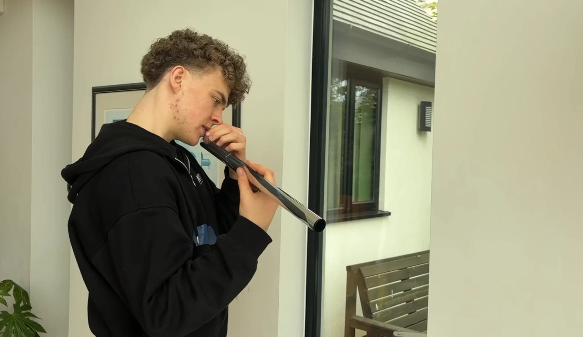 Image of george peeling a bit of Window Film ready for installation